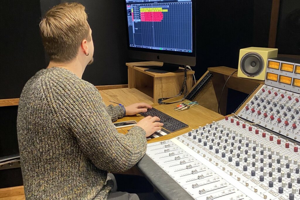 An engineer working at the console