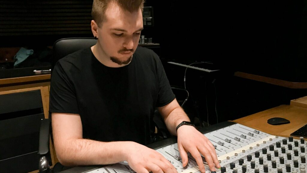 An engineer mixing on the console