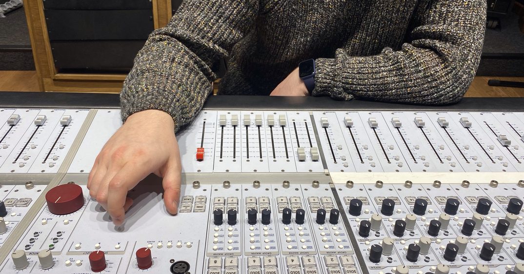 A Major Mixing engineer working the console during a stem mastering session